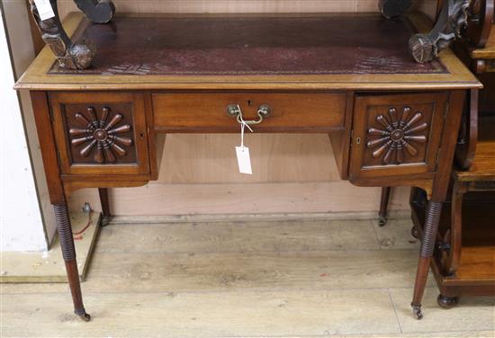 An Edwardian mahogany writing table W.107cm